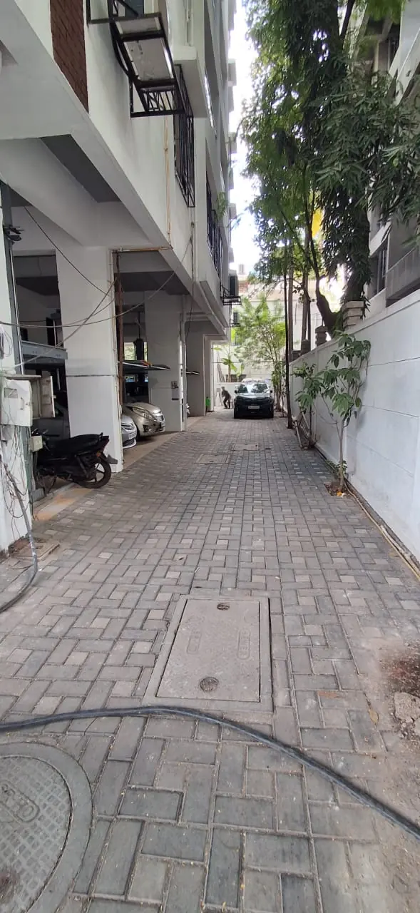 Paved internal lane running alongside the building