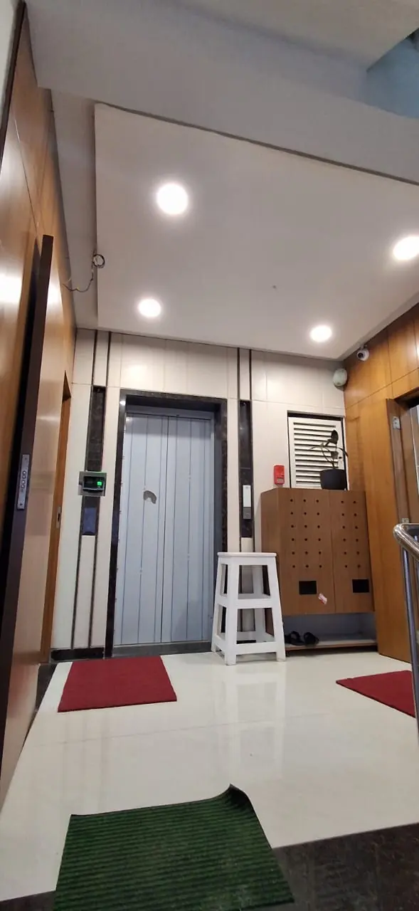 Lift lobby with timber panelling and bright lighting