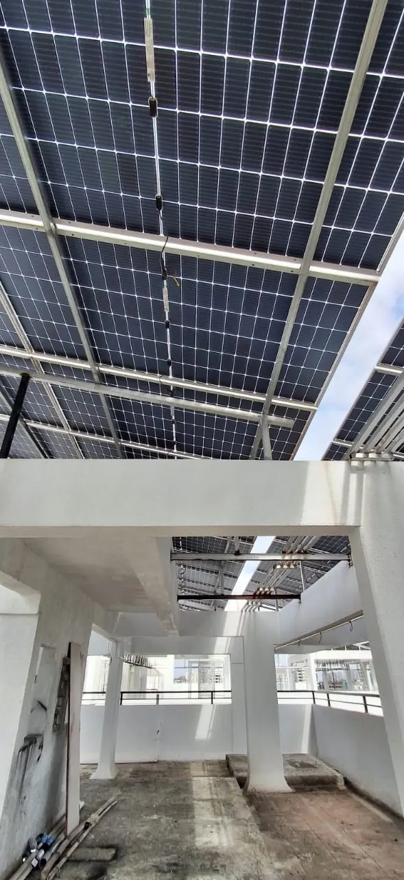 Solar panels on the roof canopy, photographed from below